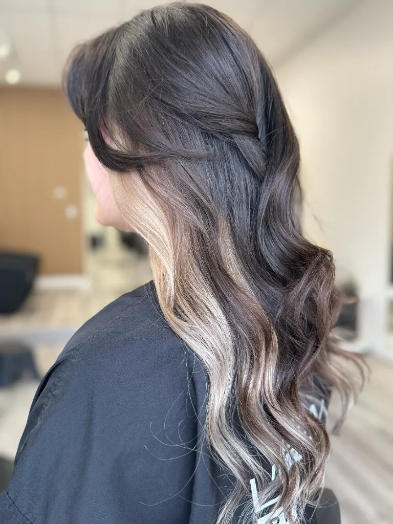 Sun-kissed balayage highlights with natural root shadow, Pacific Northwest lighting at Emilie Hair Studio, Vancouver.