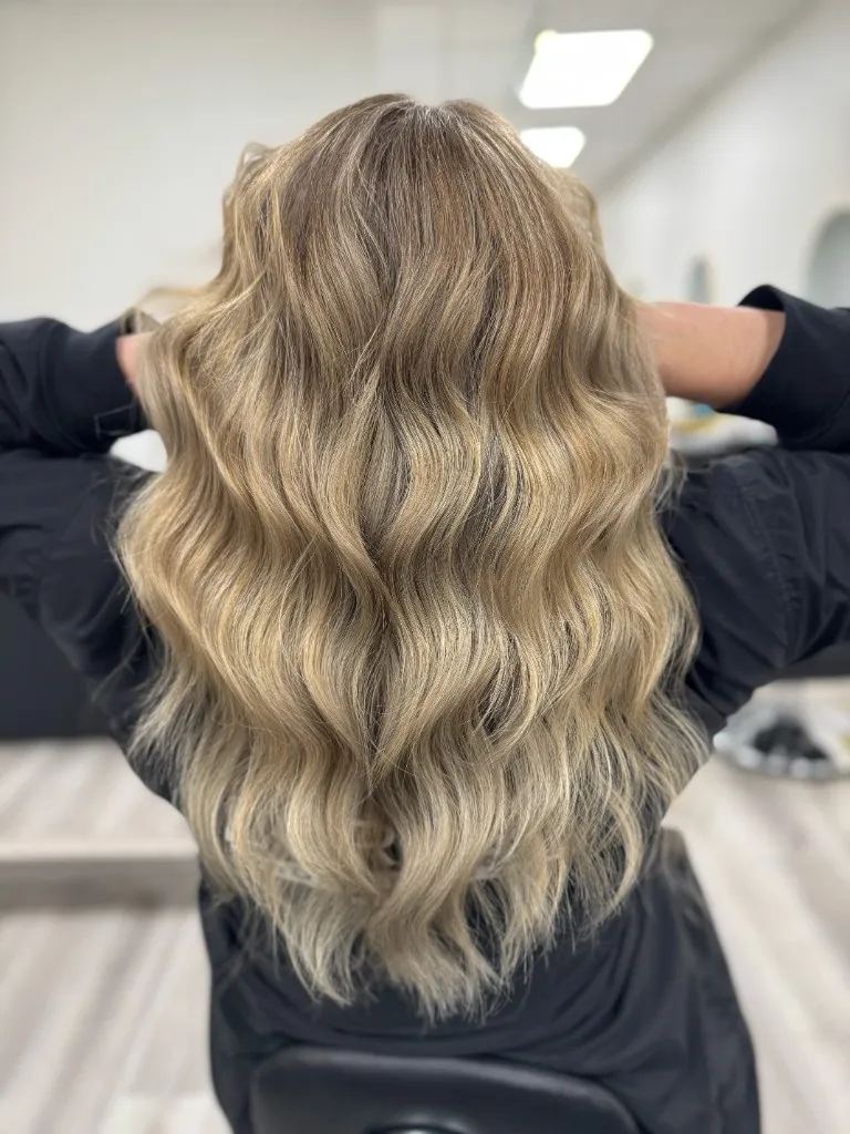 Dimensional blonde balayage with blended roots and bright ends, colour work by Emilie Hair Studio, Vancouver BC.
