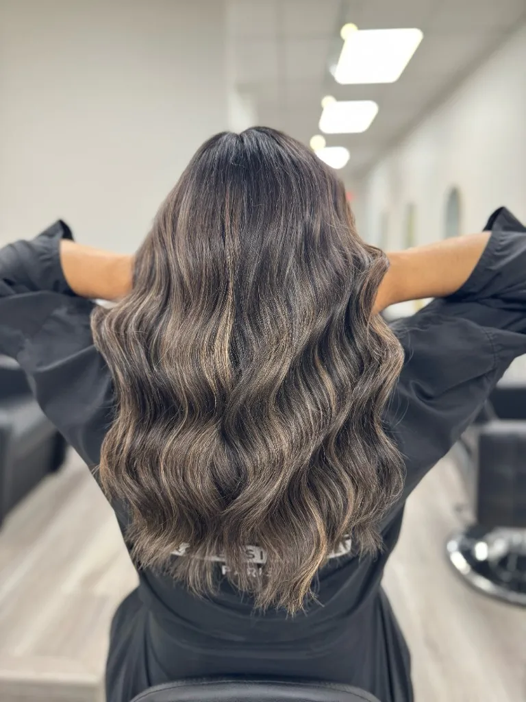 Face-framing balayage ribbons on mid-length hair, natural grow-out friendly colour at Emilie Hair Studio, East Vancouver.