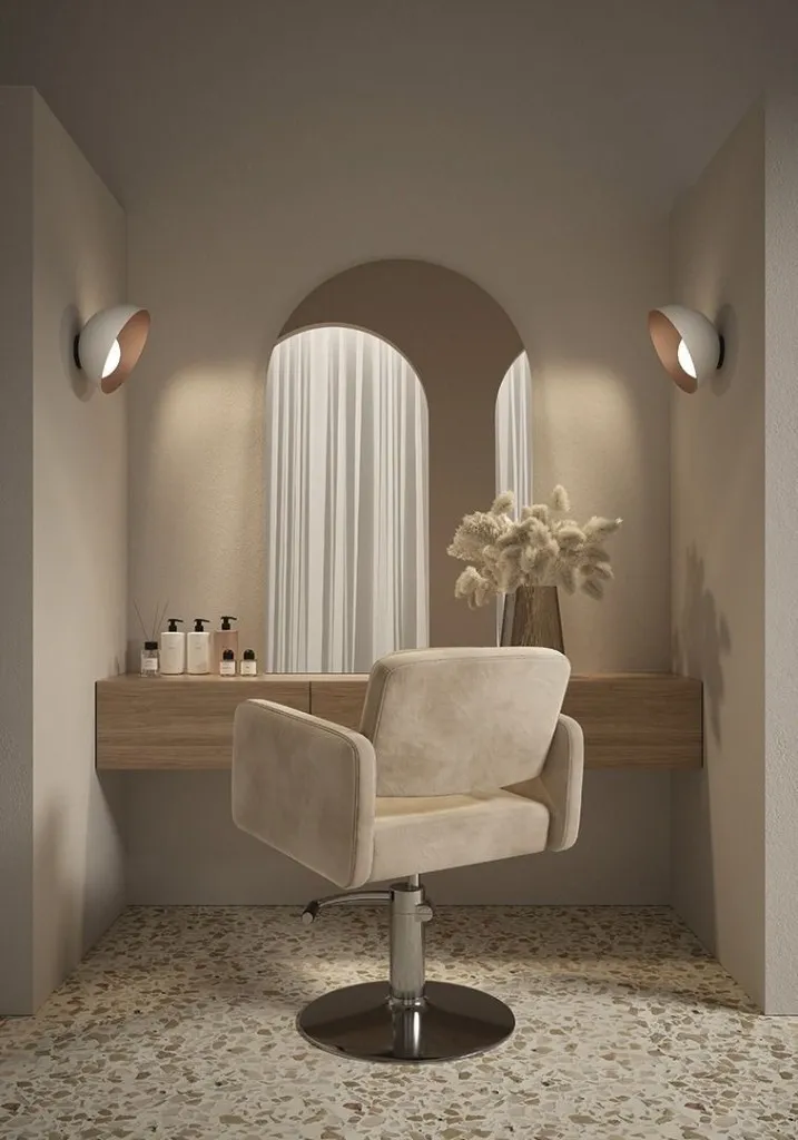 Sunlit styling nook at Emilie Hair Studio, Vancouver: arched mirror, styling chair, and warm neutral decor at 908 Kingsway, Mount Pleasant area.